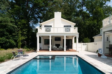 A custom pool house with outdoor living area.