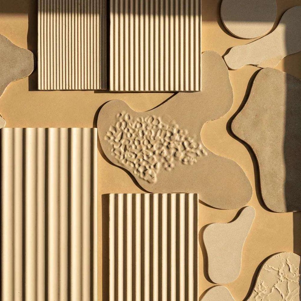 Artistic arrangement of textured and organic tiles showcasing their depth and warmth