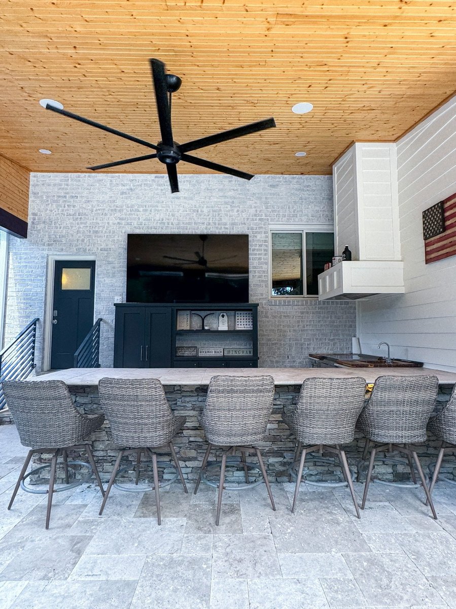 charlotte nc home project covered outdoor bar with stone facade wicker seating tv and ceiling fan
