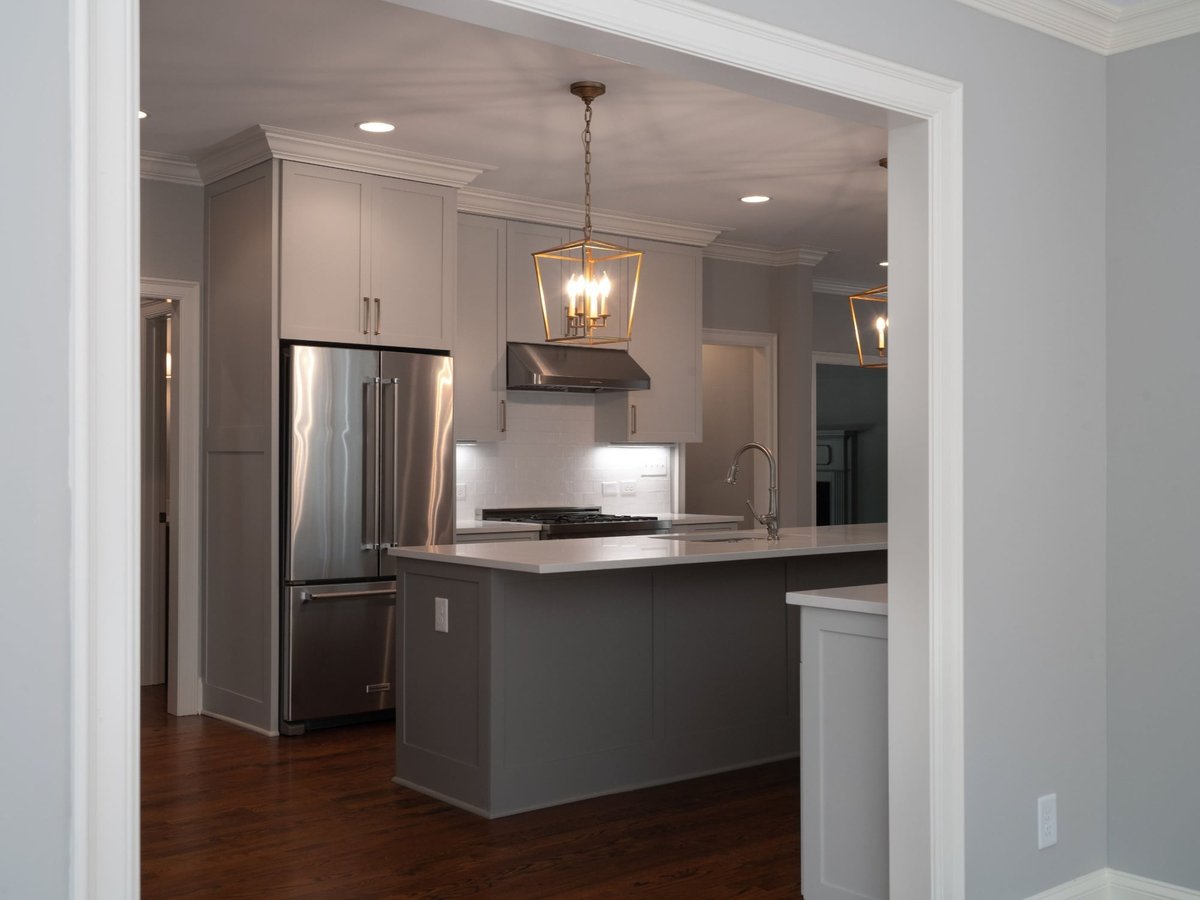 charlotte nc home project gray kitchen with island and stainless steel appliances