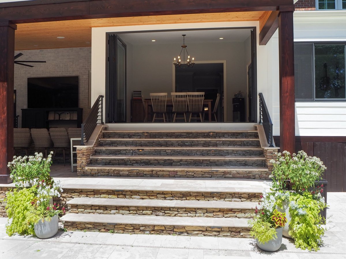 charlotte nc home project stone patio steps leading to open indoor outdoor living space