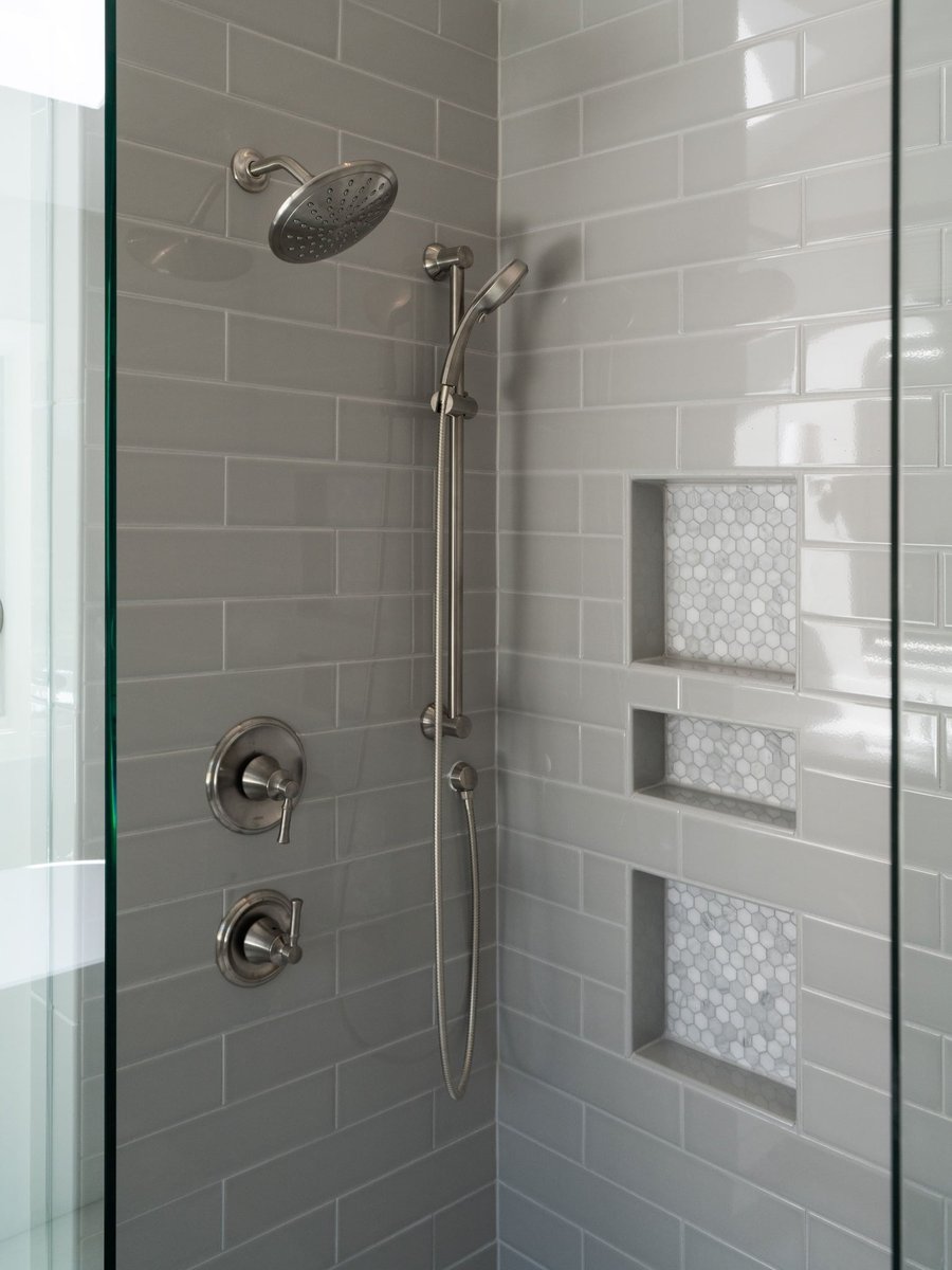 charlotte nc home project tiled shower with rain head and niches