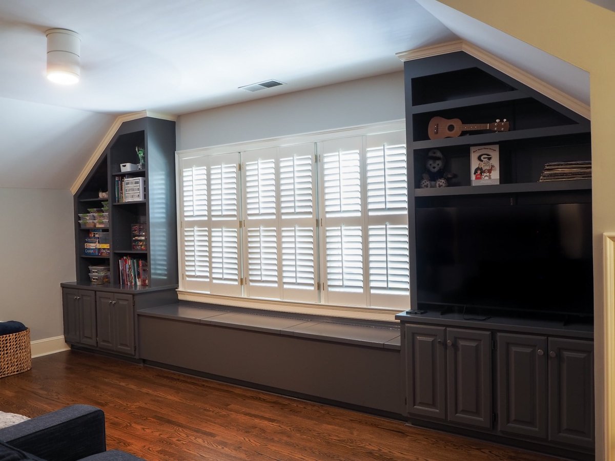 custom bonus room shelving cabinets and window bench in charlotte nc home project