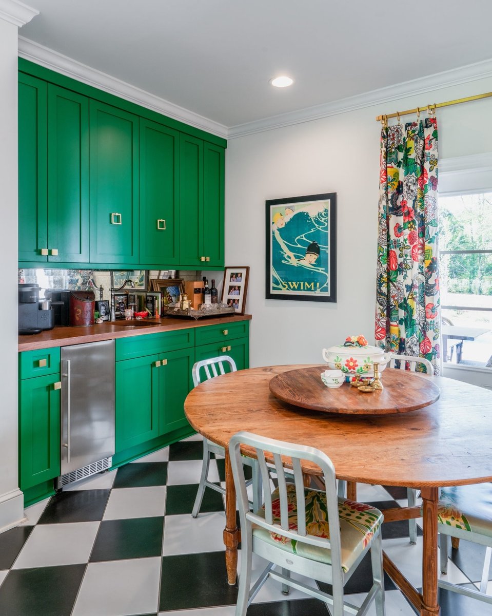 charlotte nc kitchen remodel breakfast area with green cabinets wood table floral curtains and checkerboard floor