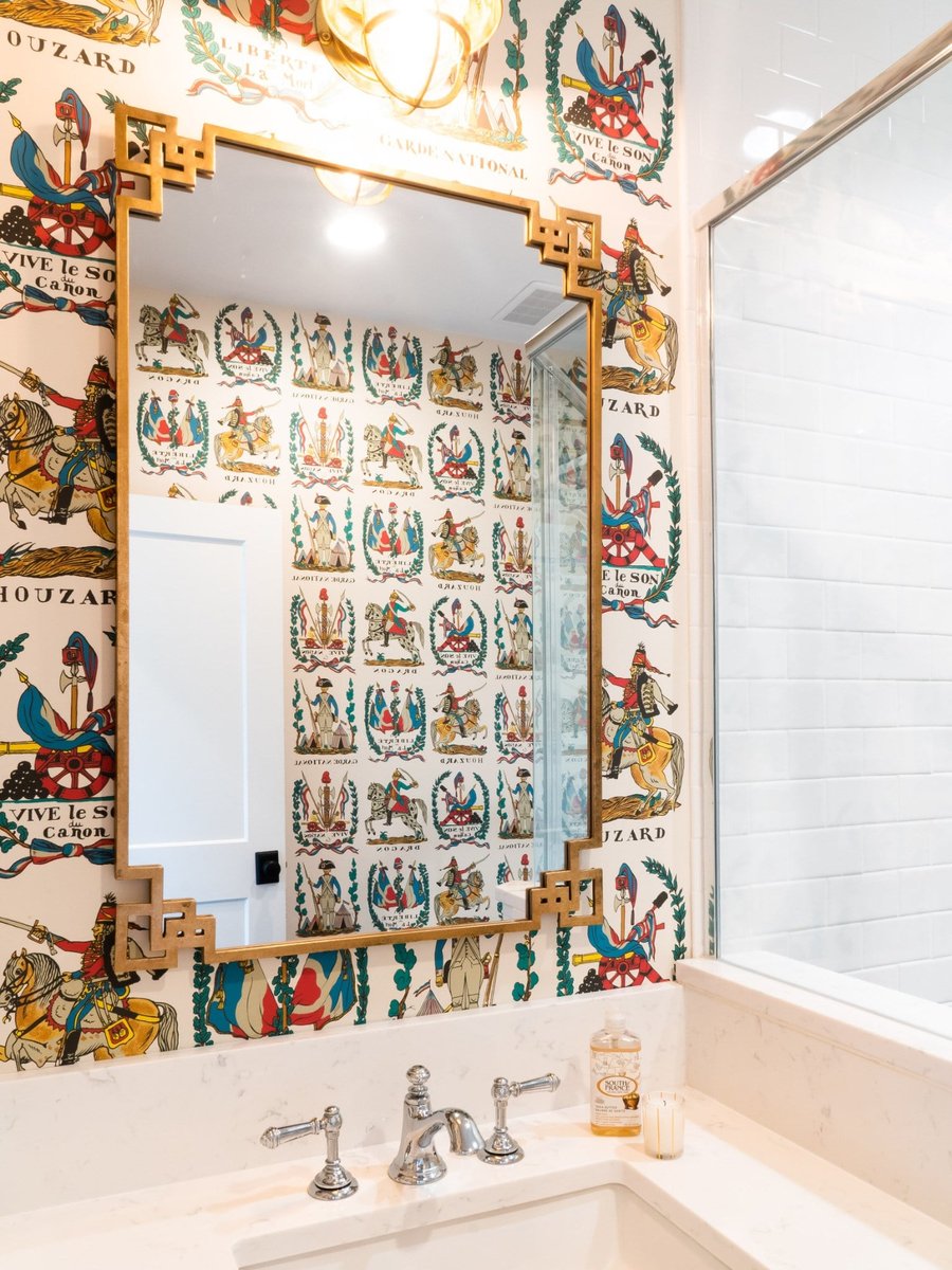 custom home bathroom with glass shower patterned wallpaper and black tile floor in charlotte nc