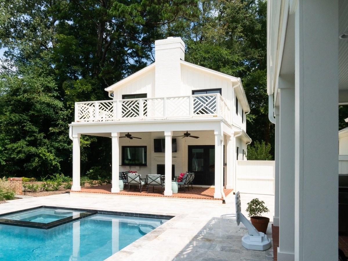 custom home pool house with covered patio upper balcony spa and swimming pool in charlotte nc