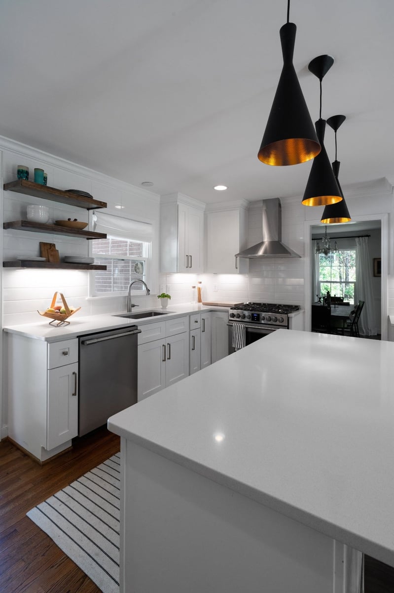 kitchen remodel with white quartz island stainless dishwasher range and open wood shelves in charlotte nc