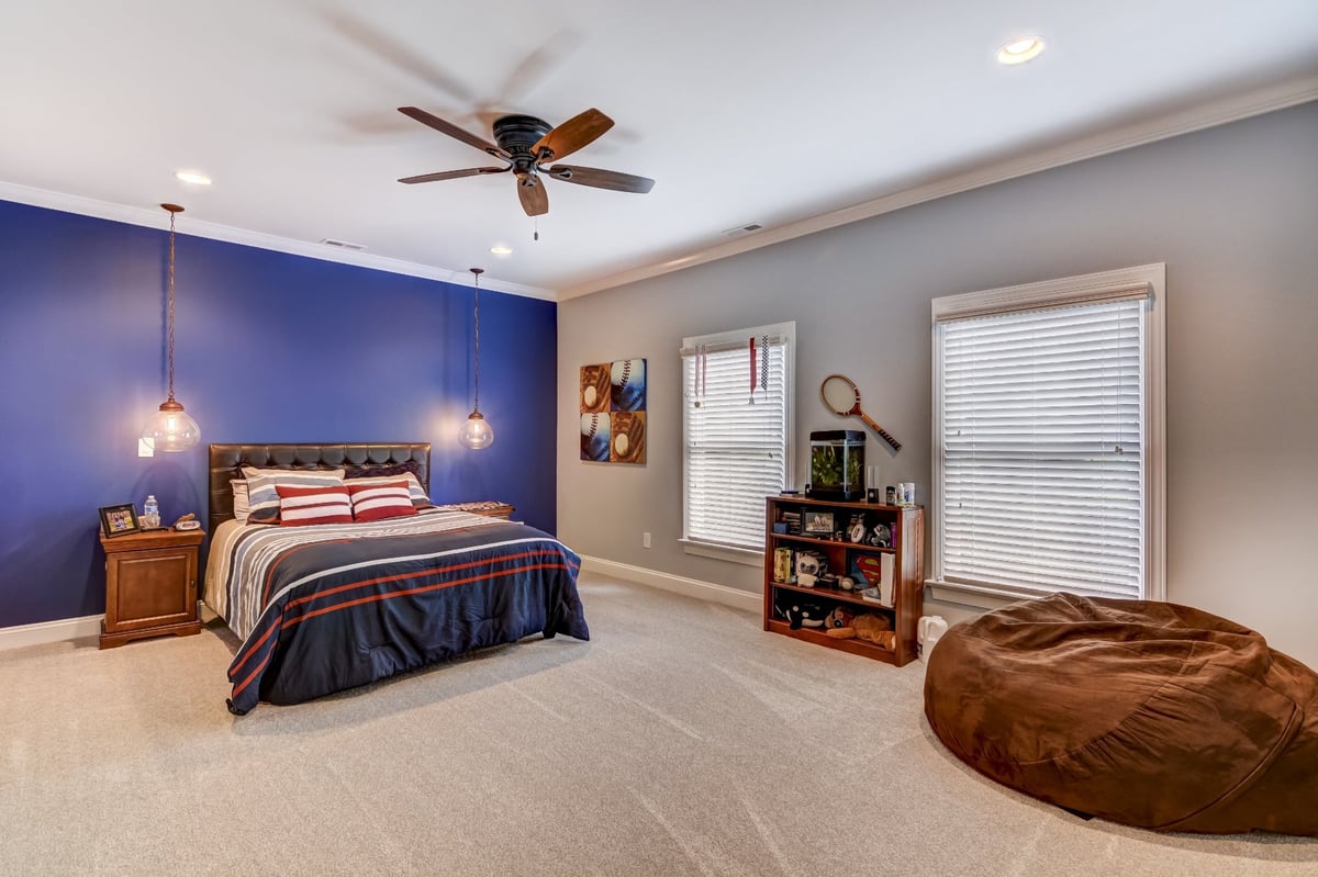 bedroom with large windows walk in closet and bean bag chair in charlotte nc whole home remodel