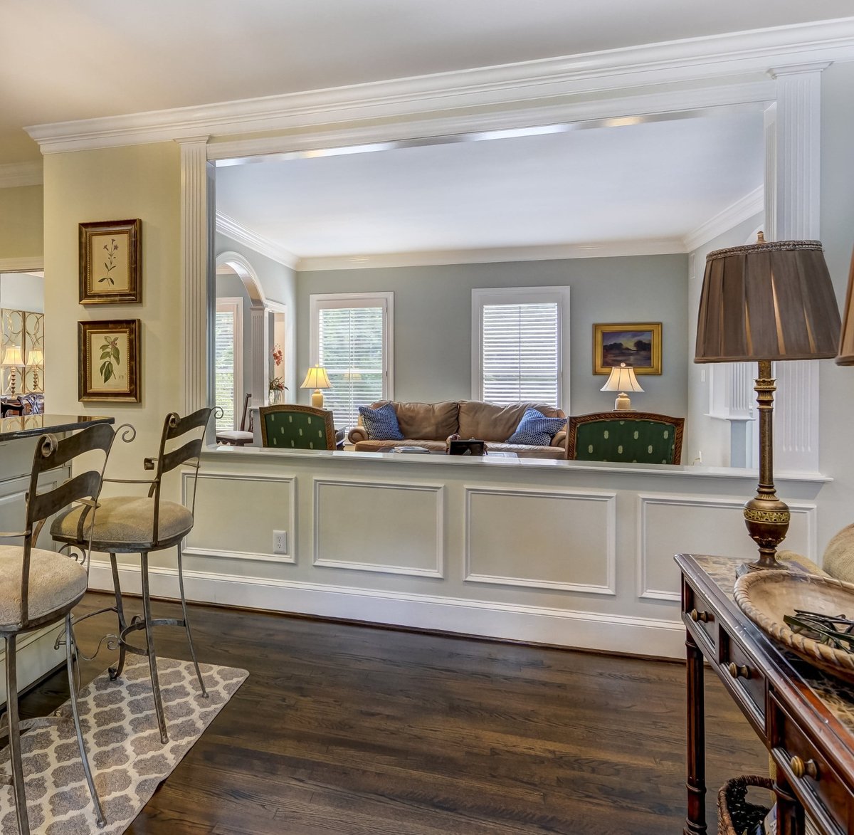 open interior with paneled half wall and view into living room in charlotte nc whole home remodel