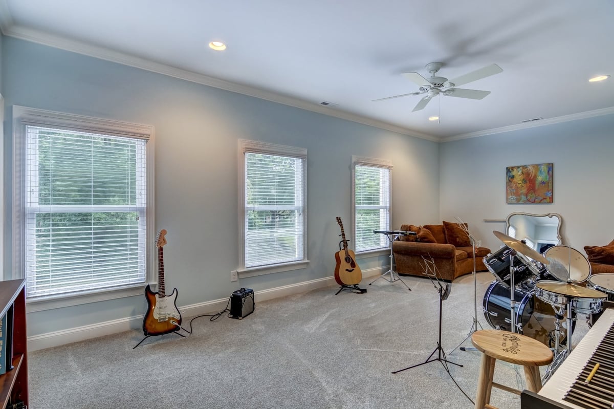spacious music room with guitars drums and piano in charlotte nc whole home remodel