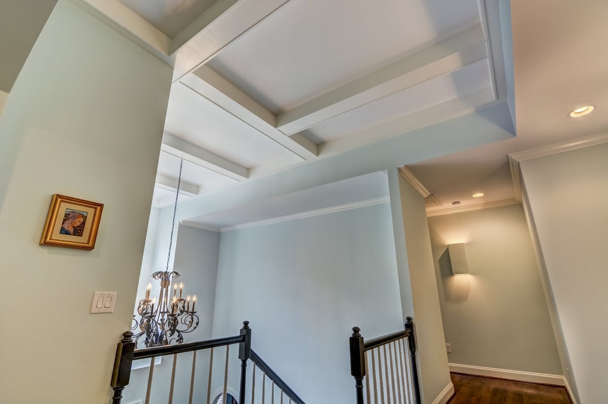 two story foyer with chandelier hardwood stairs and arched window in charlotte nc whole home remodel