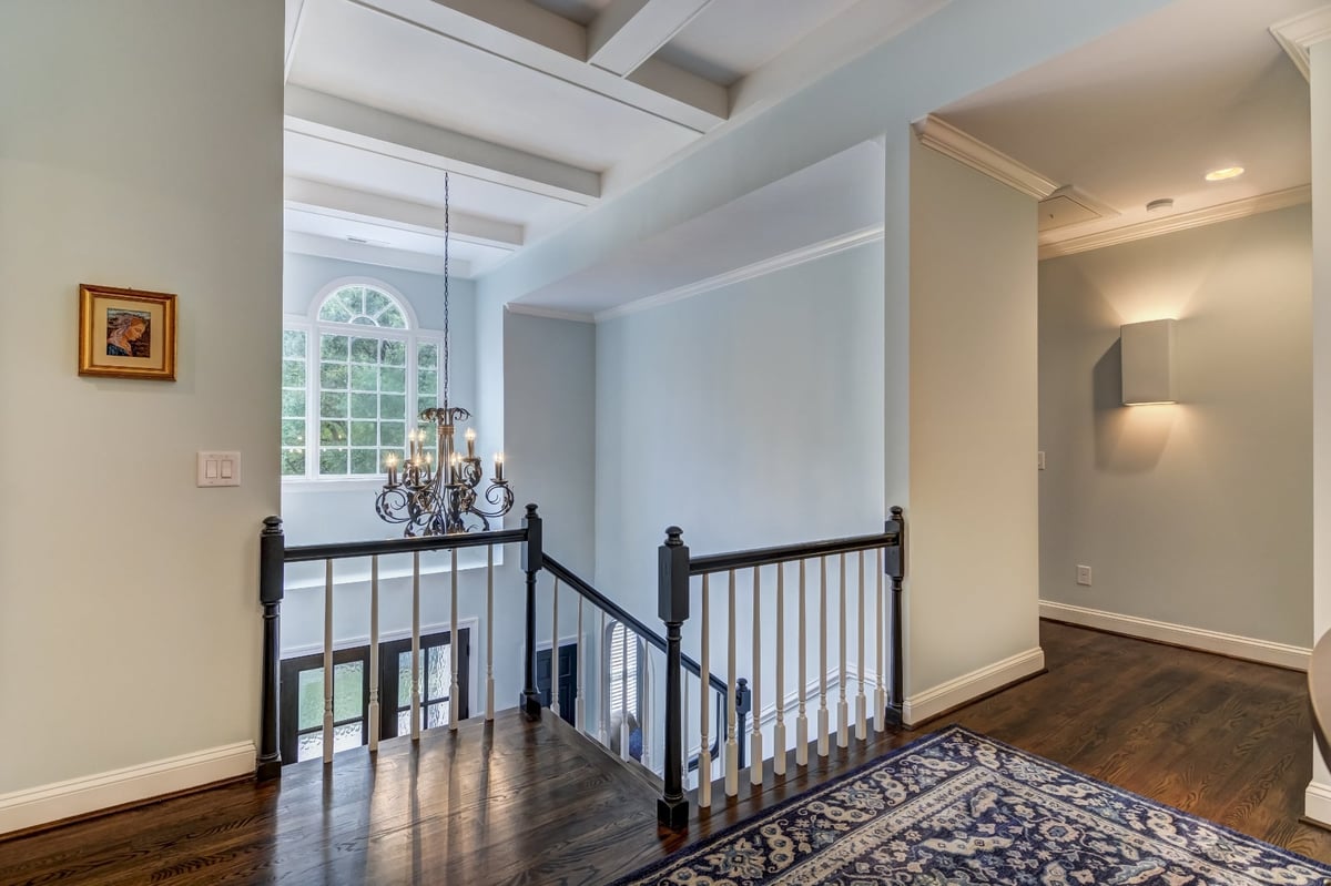upstairs stair landing with coffered ceiling and hardwood floors in charlotte nc whole home remodel