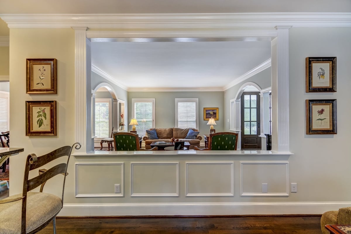 wide paneled opening from kitchen area into traditional living room in charlotte nc whole home remodel