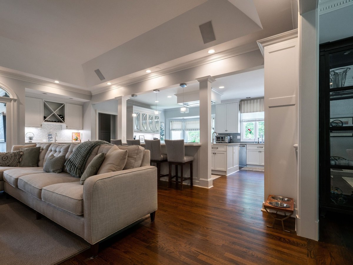 living room view into bright white kitchen in charlotte nc first floor remodel
