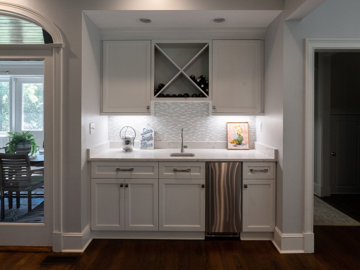 recessed wet bar with sink and wine rack in charlotte nc first floor remodel