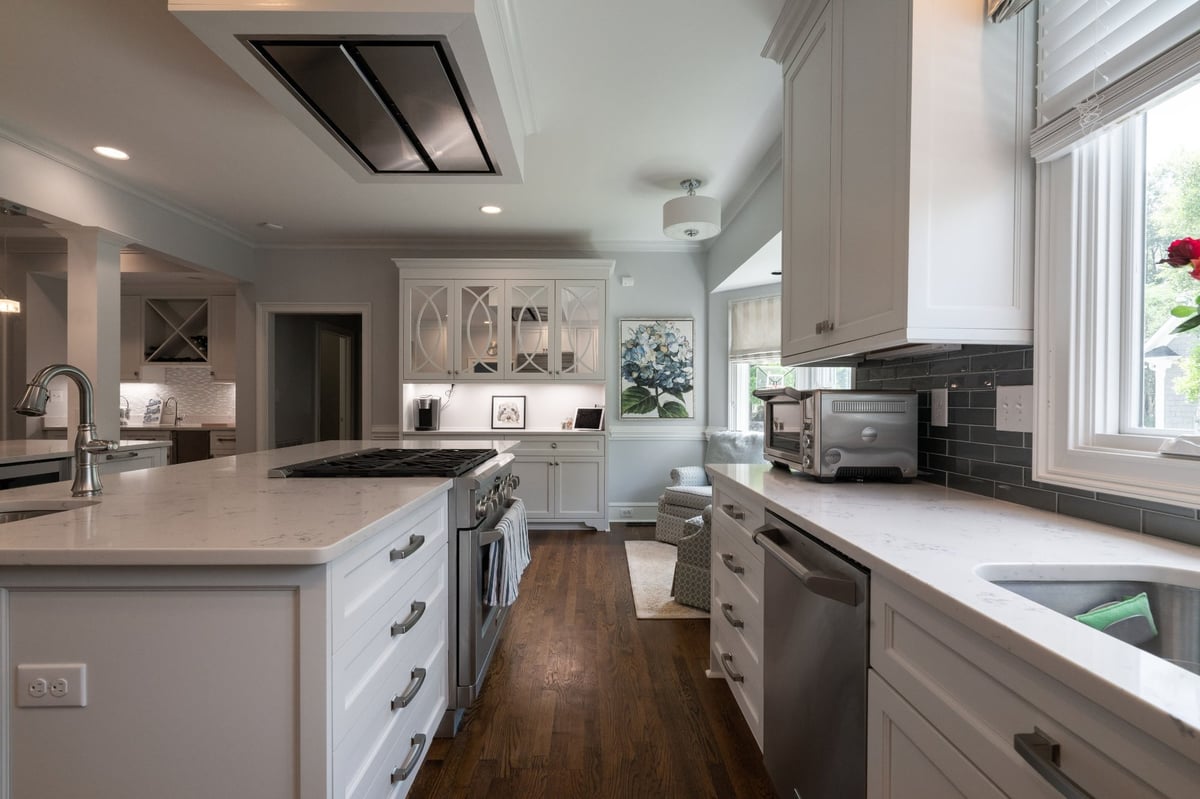 white kitchen with island and built in display cabinets in charlotte nc first floor remodel