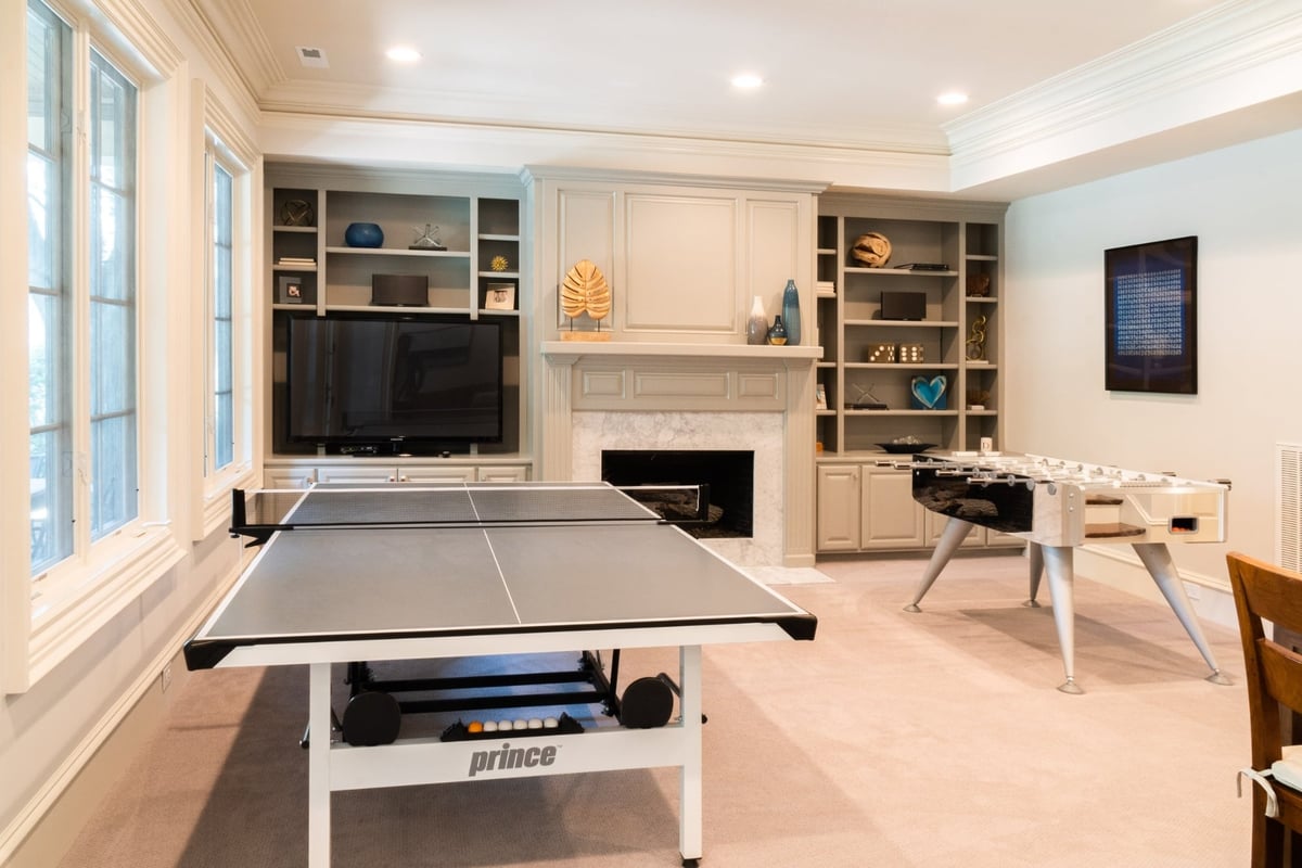 basement recreation room with ping pong table foosball and built ins in charlotte nc whole home remodel