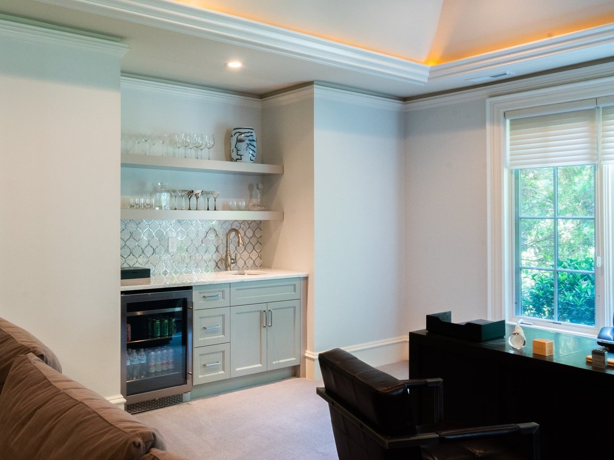 recreation room wet bar with floating shelves and beverage refrigerator in charlotte nc whole home remodel