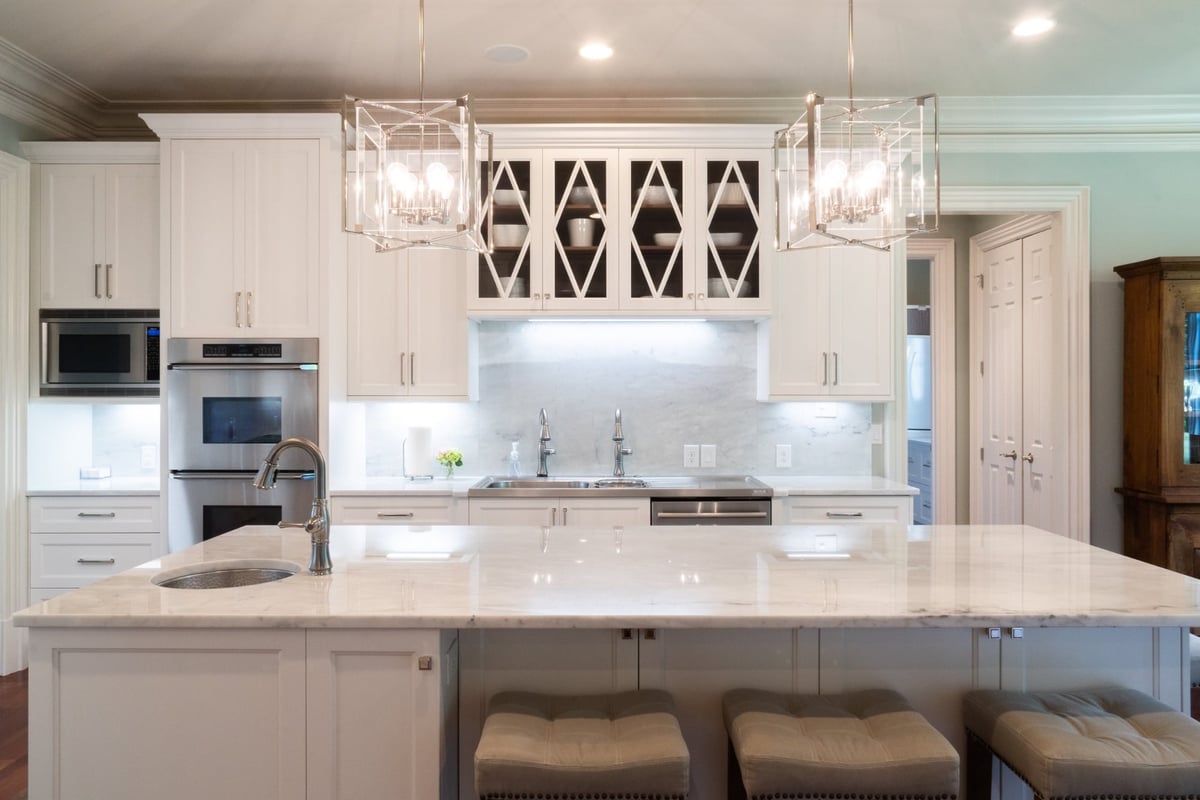 whole home remodel kitchen with marble island double sink and glass front cabinets in charlotte nc