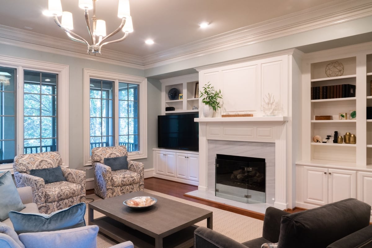 whole home remodel living room with patterned armchairs fireplace and built ins in charlotte nc