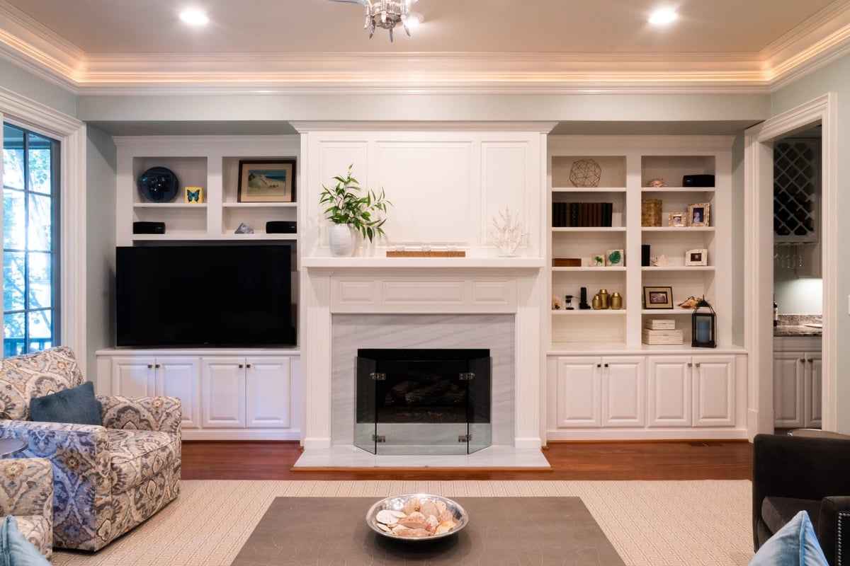 whole home remodel living room with white built ins fireplace and tv in charlotte nc