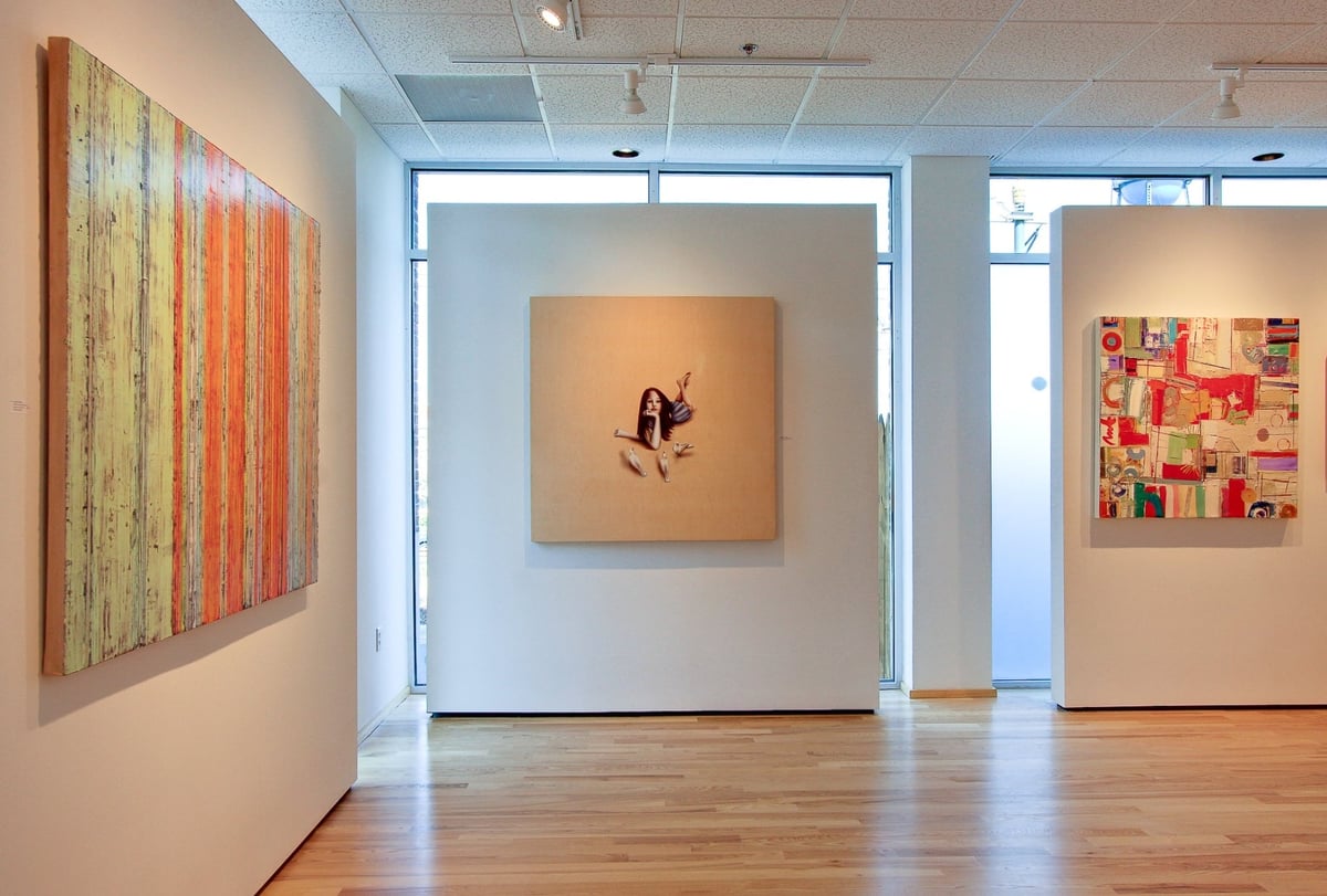 art gallery interior with colorful contemporary paintings after a commercial remodel in charlotte nc