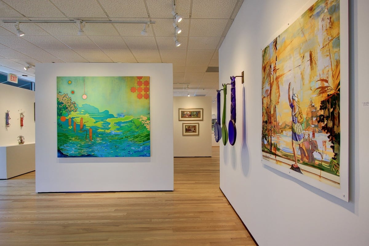 modern art gallery interior with large paintings and wood flooring after a commercial remodel in charlotte nc