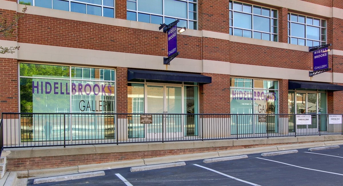 spacious contemporary art gallery interior with colorful paintings after a commercial remodel in charlotte nc