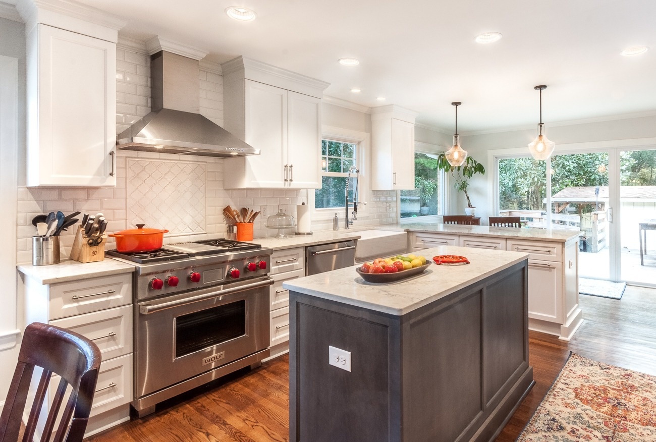 kitchen remodel with professional range gray island white cabinets and quartz countertops in charlotte nc