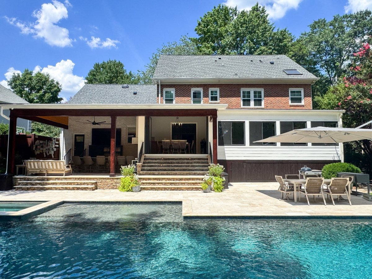 charlotte nc home project wide backyard pool with covered patio and brick home