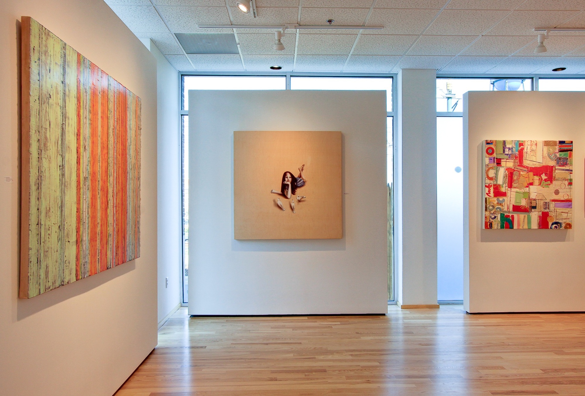 art gallery interior with colorful contemporary paintings after a commercial remodel in charlotte nc