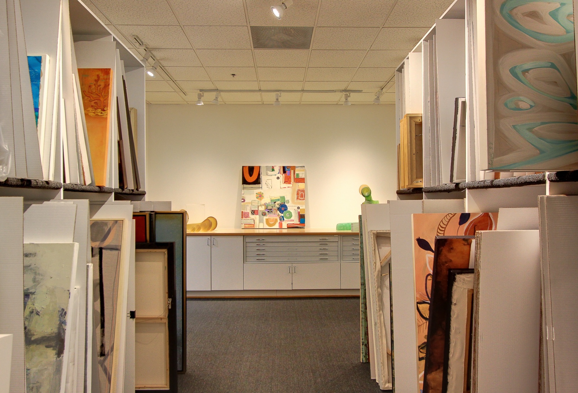 art storage area with organized paintings and cabinetry after a commercial remodel in charlotte nc