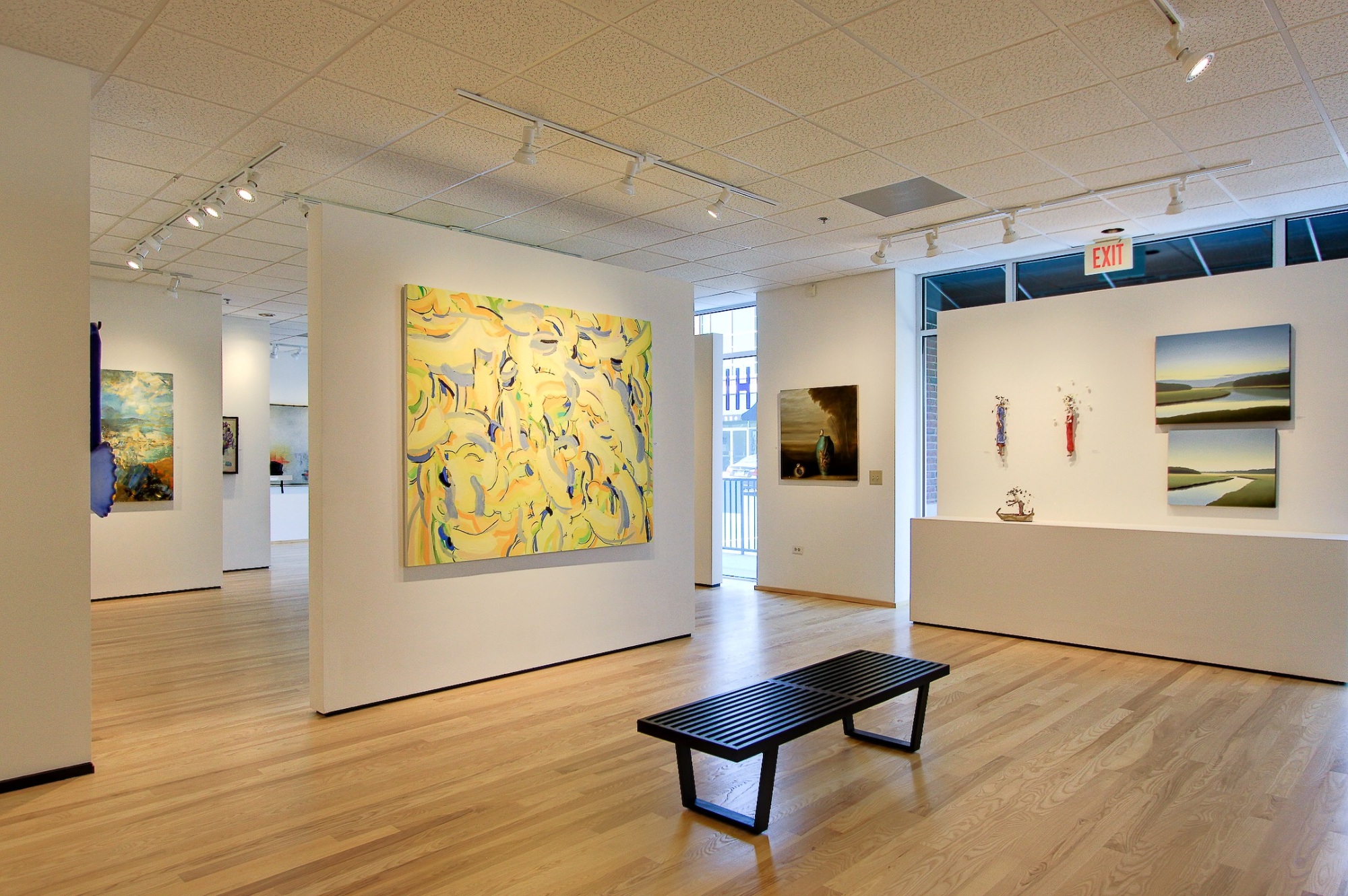 colorful contemporary art displayed in bright gallery interior after a commercial remodel in charlotte nc