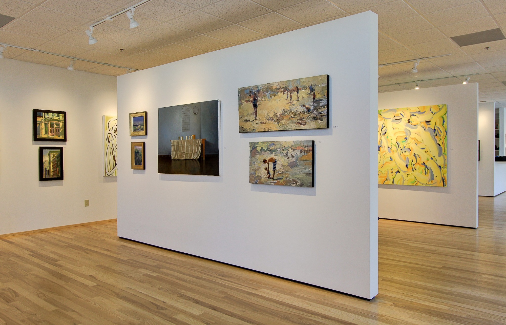 contemporary art displayed on freestanding gallery walls after a commercial remodel in charlotte nc