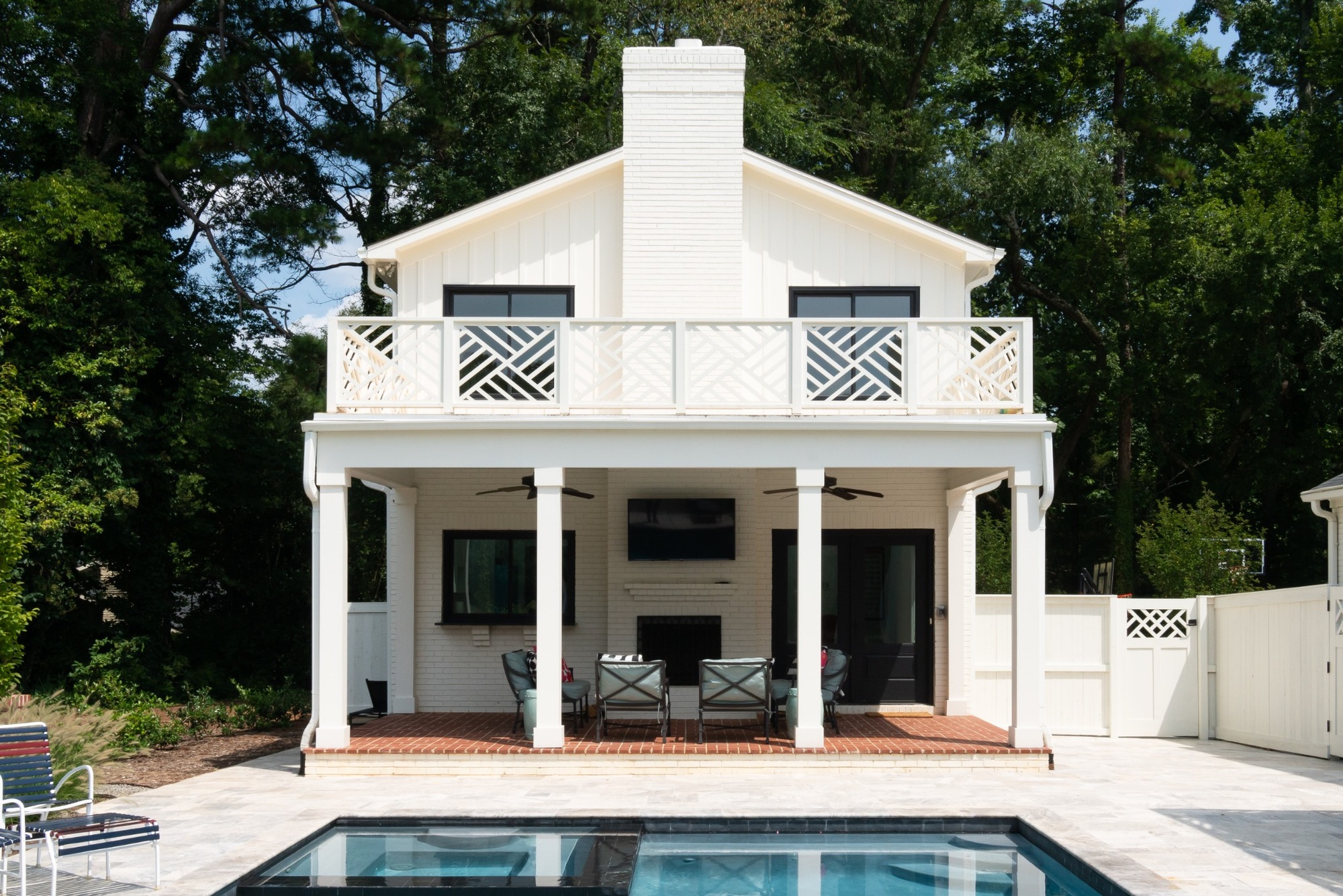 two story custom home pool house with covered fireplace patio balcony and swimming pool in charlotte nc