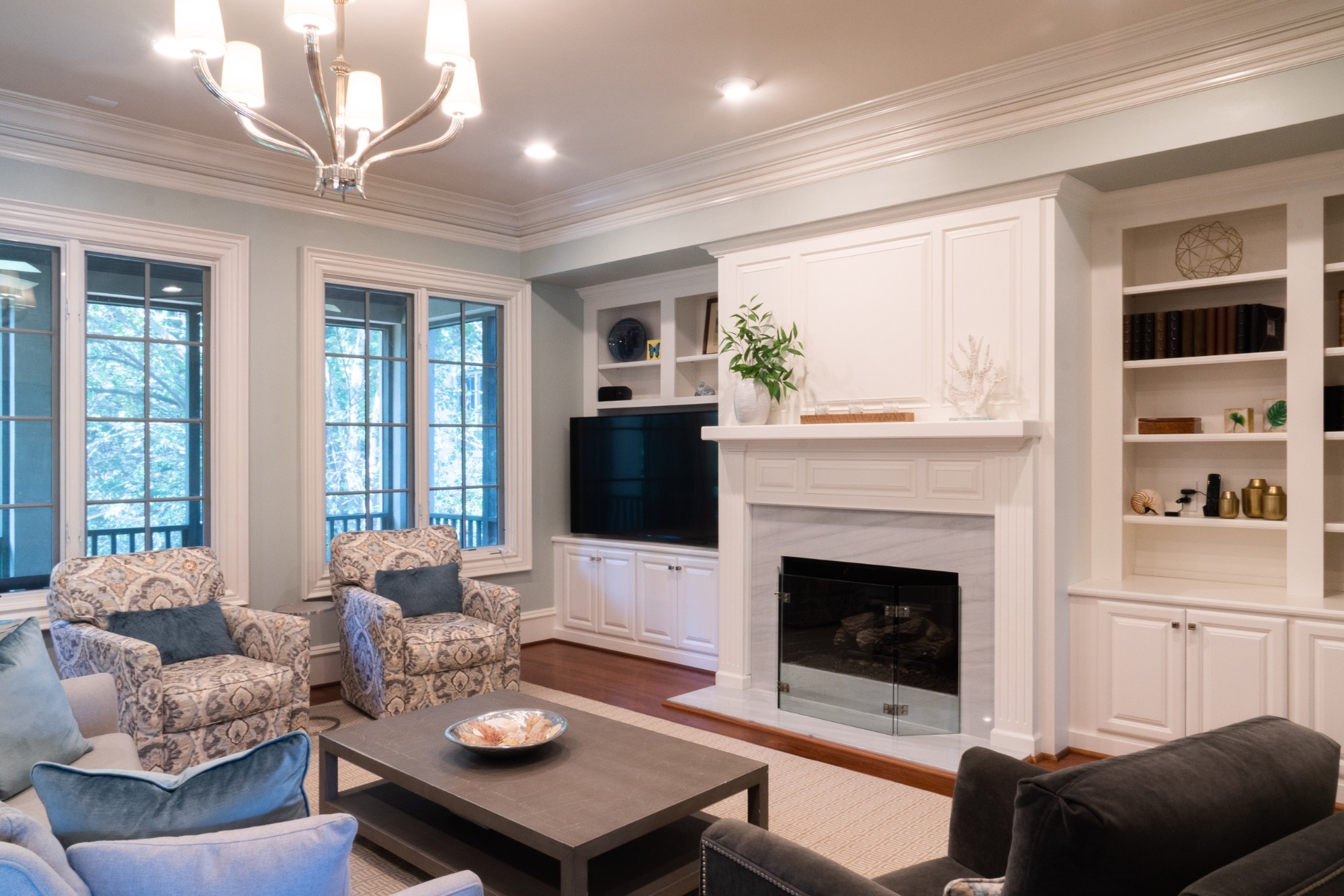 whole home remodel living room with patterned armchairs fireplace and built ins in charlotte nc
