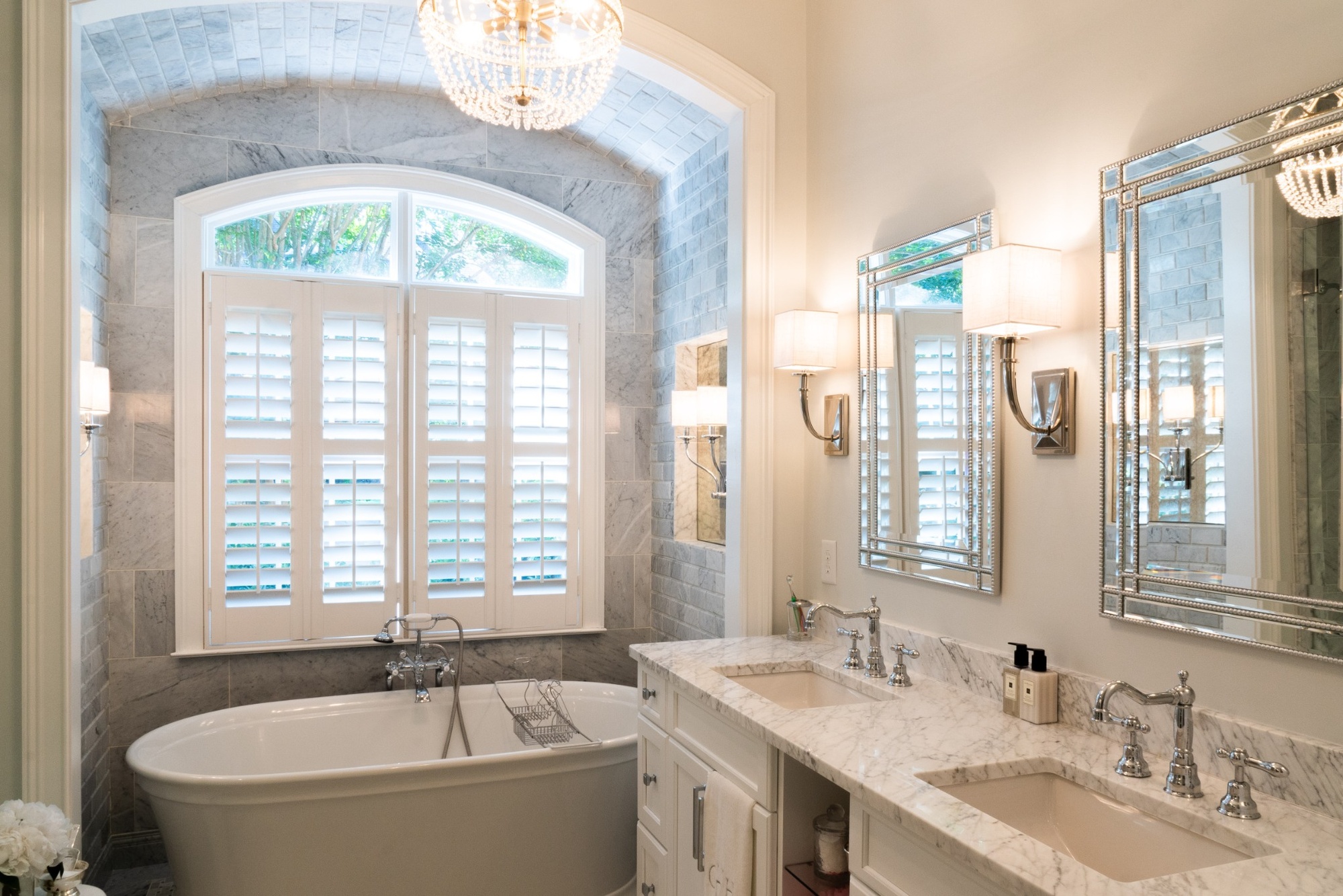 marble tile surround with arched window and soaking tub in charlotte nc bathroom remodel