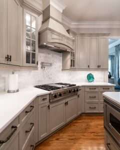 custom kitchen renovation and remodeling with stove and vent done by 7 Acre construction