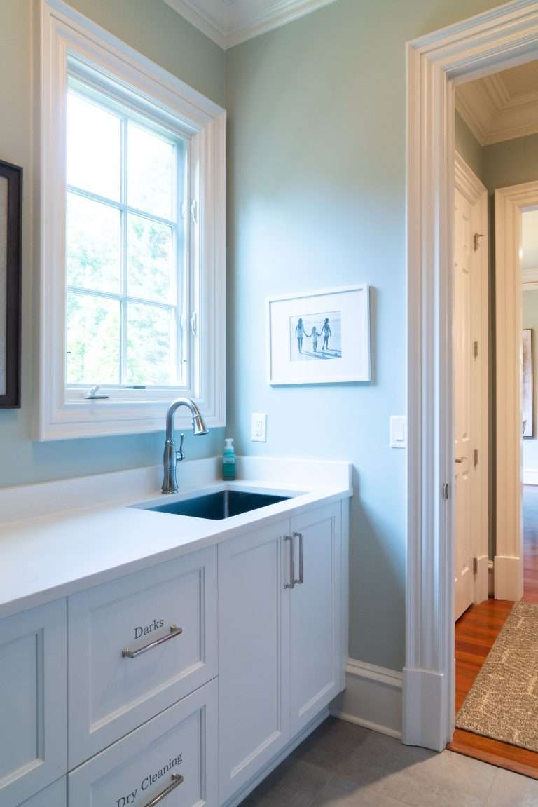 bathroom cabinetry and sink in remodeled bathroom by 7 Acre Construction